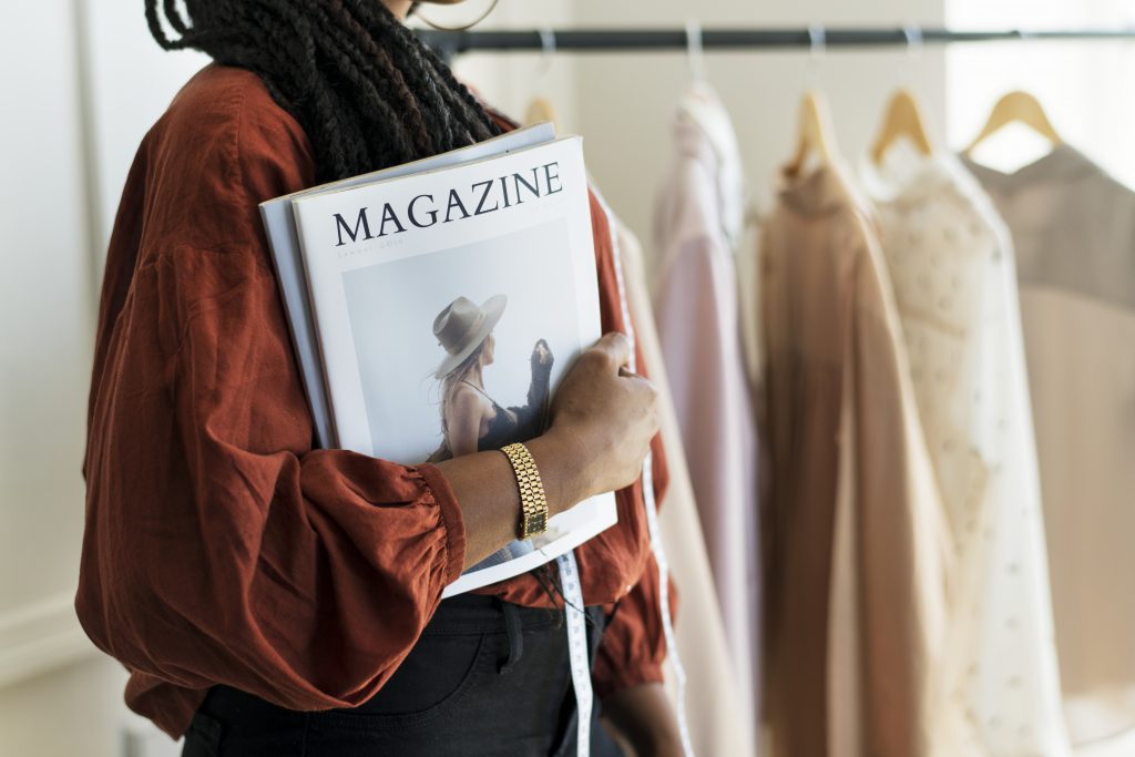 Young-female-designer-holding-a-fashion-magazine
